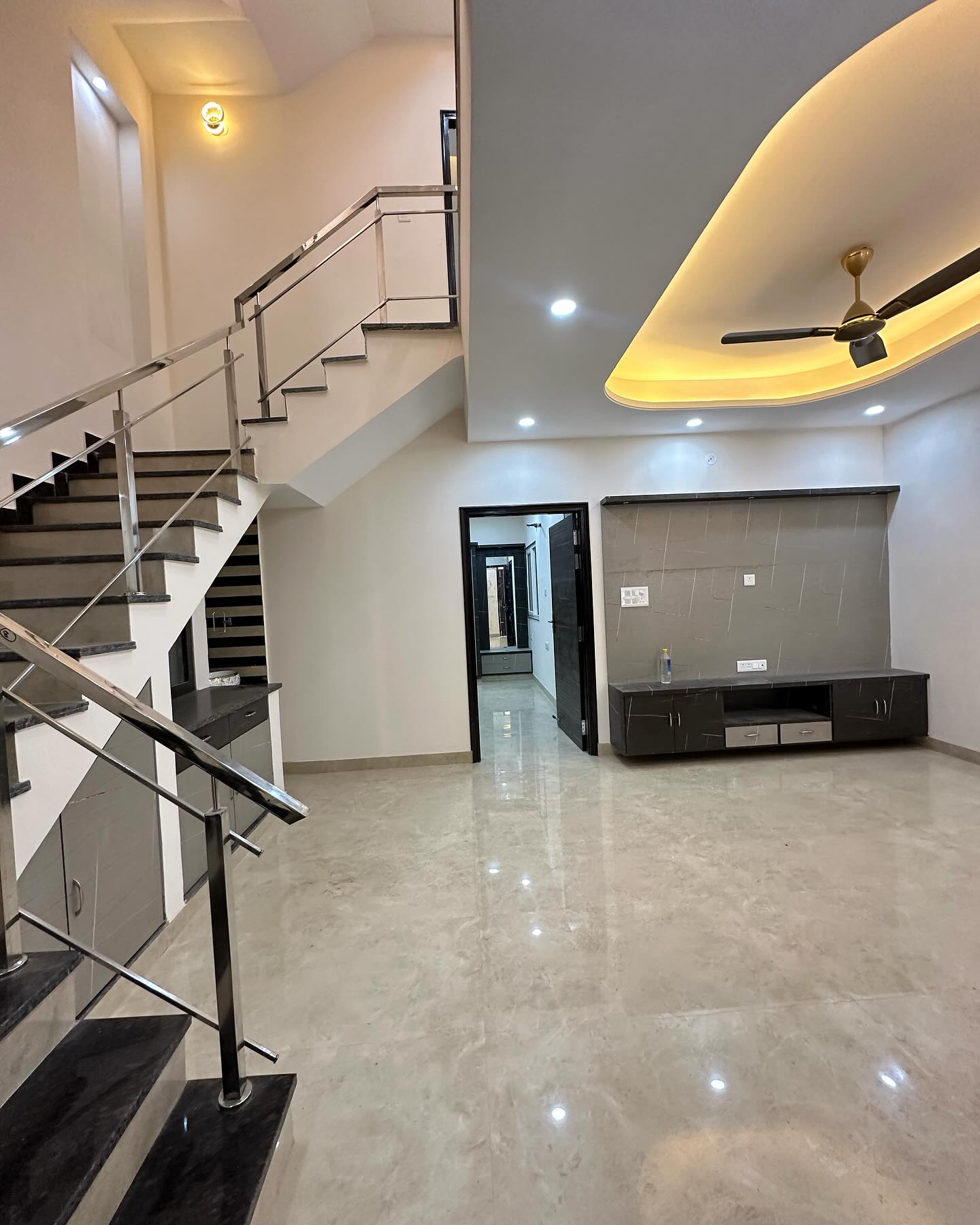 Low Budget Living Room Decor Featuring Sleek Staircase